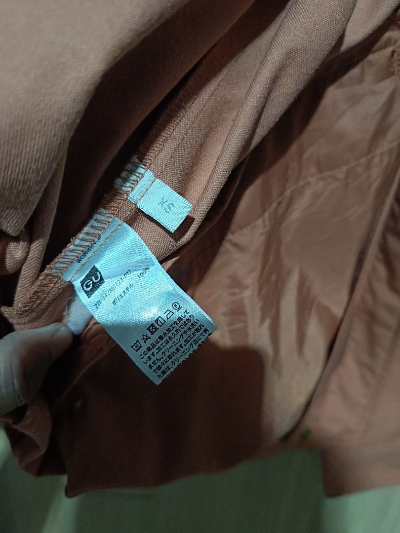 GU MOUNTAIN PARKA (Category: Coats, Jackets and Outerwear) located in Angeles City. Submitted by faeyhang0223 (Listing ID 1468718809, Image 3). Description: - Brand: GU - Color: Dusty Pink - Size: XS (Tag attached) - Material: 100% Polyester - Closure: Full zip with snap button flap - Pockets: Two front flap pockets with buttons - Features: Drawstring hem and fully lined interior - Condition: Clean inside and out, brand new with tag.