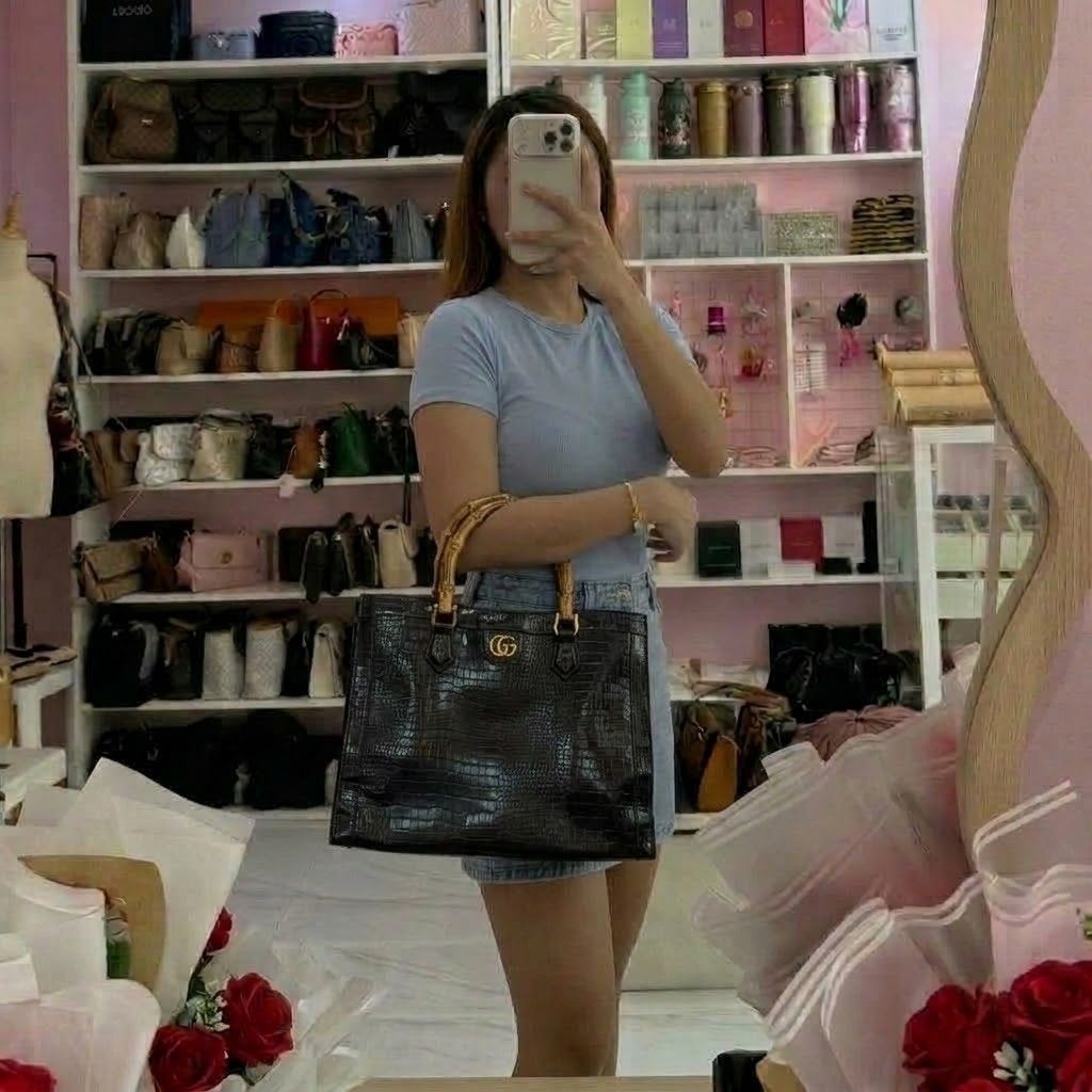 Gucci Dianna silhouette bag (Category: Luxury Bags & Wallets) located in Bacolod. Submitted by lux.antithrifts (Listing ID 1468765670, Image 2). Description: Materials: Crafted from black crocodile-embossed leather paired with distinctive, expertly curved natural bamboo top handles. Hardware: Features gold-tone hardware, including the signature Double G metal logo anchored on the upper center front. Design & Structure: A structured rectangular to