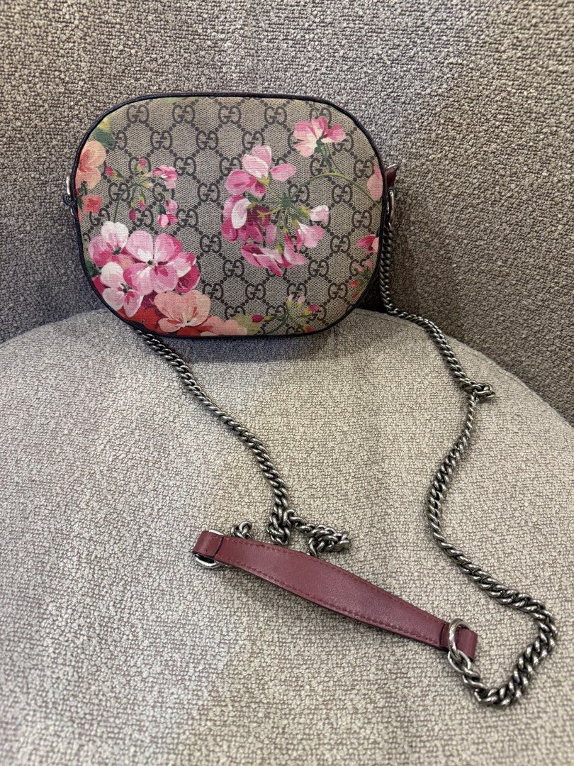 Gucci GG Supreme Blooms Print Camera Bag (Category: Luxury Bags & Wallets) located in Manila. Submitted by savsev (Listing ID 1468778931, Image 2). Description: Gucci GG Supreme canvas camera bag with pink geranium print. Antique silver chain strap with pink leather shoulder pad. Zip closure on top, fabric interior lining with slip pocket and brand tag inside. Compact size, everyday style..