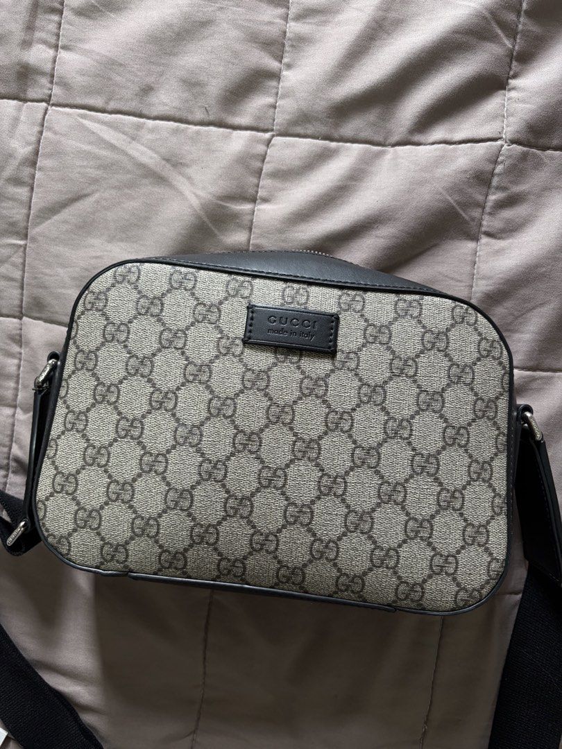 Gucci GG Supreme Canvas Messenger Bag (Category: Luxury Bags & Wallets) located in Manila. Submitted by rich028 (Listing ID 1468731925, Image 1). Description: - Brand: Gucci - Material: GG Supreme canvas with black leather trim - Hardware: Silver-toned - Closure: Secure zip top - Strap: Adjustable web strap with charming mini key detail - Interior: Soft fabric lining with zip pocket and official leather brand tag - Condition: Clean stitching, str