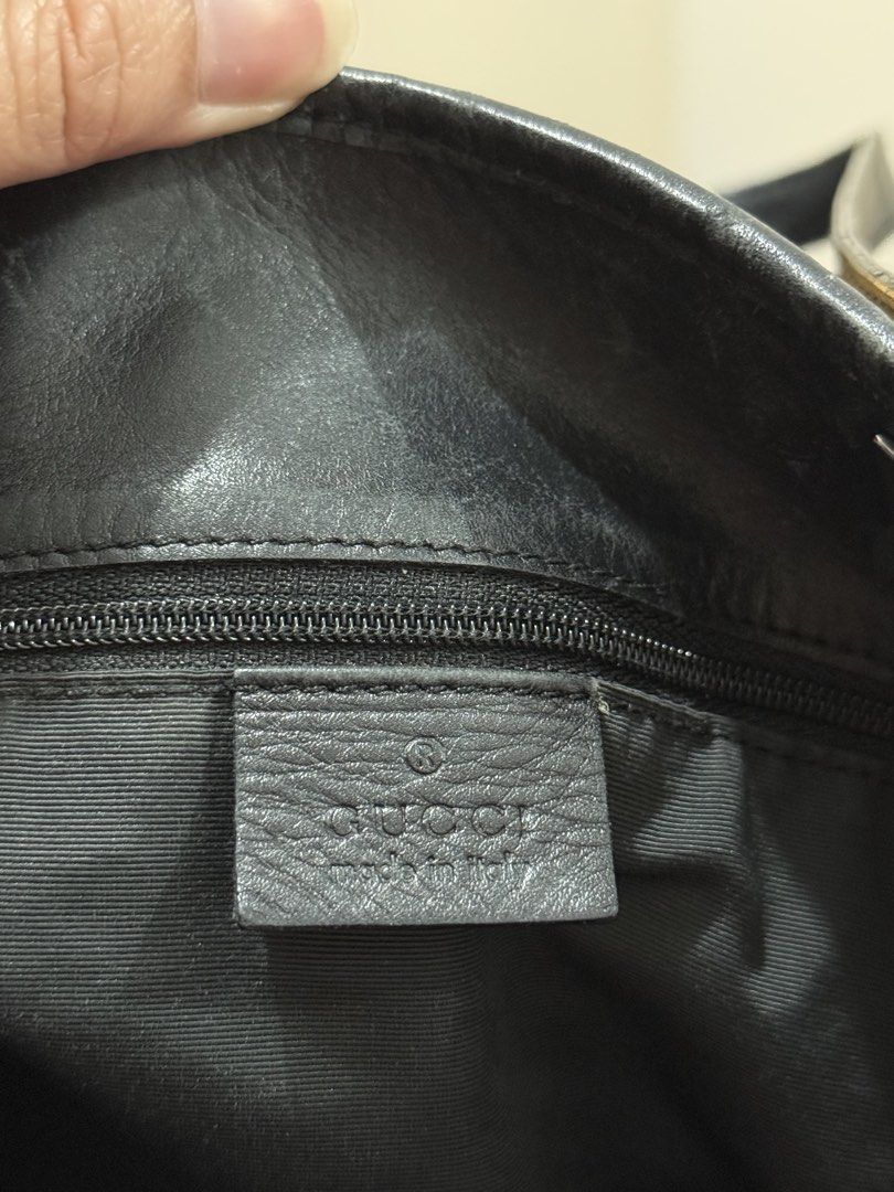 Gucci Monogram Black Denim Tote Bag (Category: Tote Bags) located in Manila. Submitted by calmpenguin.043b6a (Listing ID 1468750973, Image 2). Description: - Brand: Gucci - Style: Denim GG Monogram Tote - Color: Black denim with black leather trim - Hardware: Silver-tone with engraved Gucci lettering - Interior: Black fabric lining with zippered pocket, leather brand tag, and serial number - Dimensions: Approx. 14" height - Condition: Clean overa