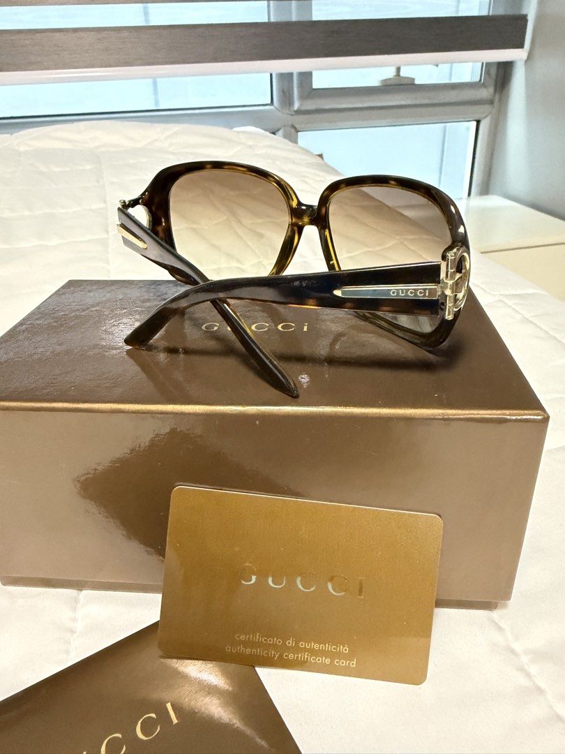 Gucci Tortoiseshell Sunglasses with Box and Certificate (Category: Sunglasses & Eyewear) located in Manila. Submitted by chanelmari19 (Listing ID 1468724113, Image 2). Description: - Brand: Gucci - Authentic - Style: Oversized frames in tortoiseshell brown with gradient lenses - Details: Elegant gold-tone Gucci logo on both arms - Condition: Clean, clear lenses - Inclusions: Original brown storage box, authenticity certificate card, and envelope 