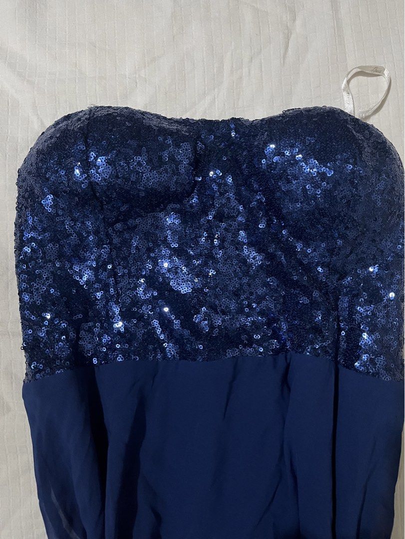 Guess 1981 Blue Sequin Chiffon Strapless Dress Size M (Category: Dresses) located in Quezon City. Submitted by earthtodior (Listing ID 1468731043, Image 2). Description: - Brand: Guess 1981 - Size: M (tag attached) - Color: Deep royal blue - Design: Sparkling sequin bodice with a flowy chiffon skirt - Closure & Fit: Side zipper closure with interior grip tape for secure, slip-free wear - Occasion: Ideal for parties, formal events, and night outs 