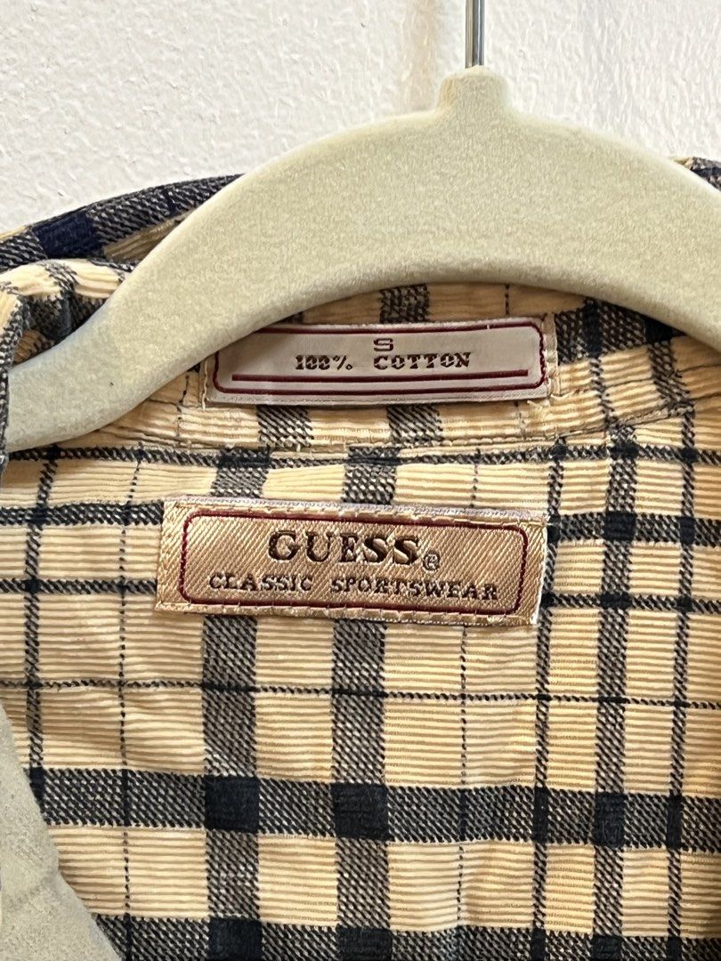 Guess Plaid Corduroy Button-down 100% Cotton (Category: Tshirts & Polo Shirts ) located in Makati City. Submitted by skustaflea (Listing ID 1468892286, Image 2). Description: - Brand: Guess Classic Sportswear - Size: Small fits like a large to medium. 69cm length (front) 77cm length (back) and around 50cm for the width - 100% Cotton - Beige and navy plaid pattern on long sleeve corduroy, has embroidered Guess logo and curved hemline as well Cute 