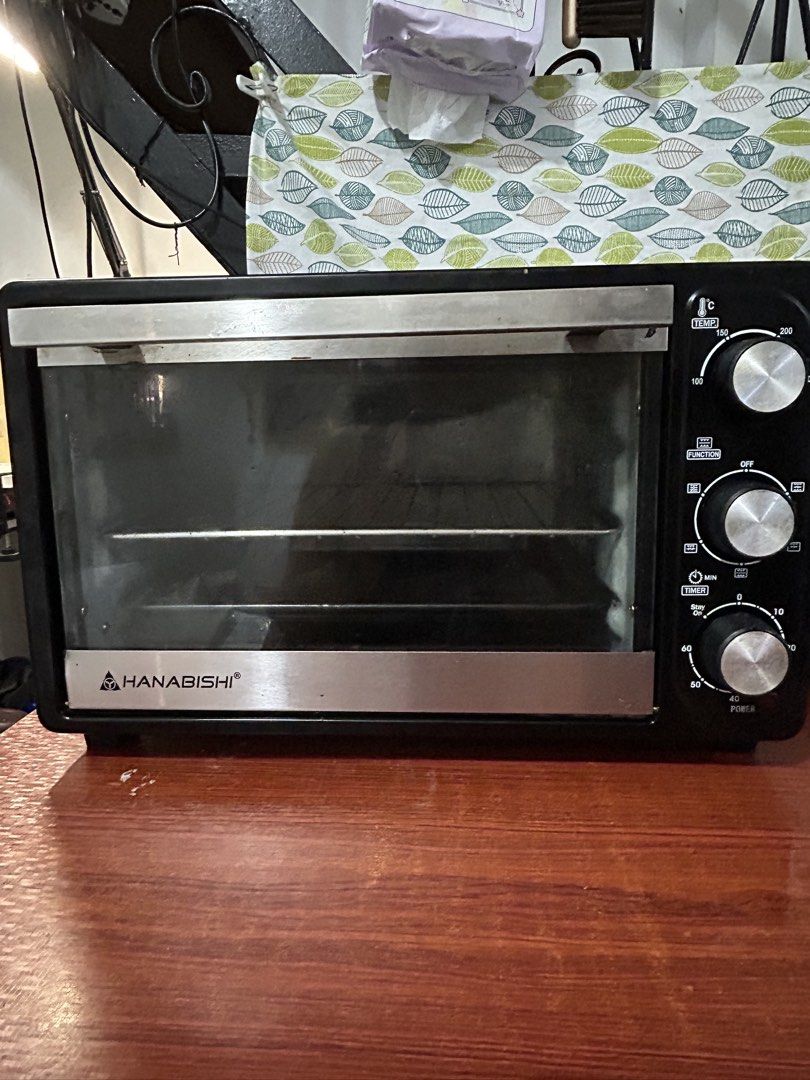 Hanabishi Electric Oven with Temperature and Timer Controls (Category: Ovens & Toasters) located in Taguig. Submitted by declutter_peach (Listing ID 1468929351, Image 1). Description: Selling my Hanabishi HEO-23R Electric Convection Oven! ✨ Details: * Brand: Hanabishi * Model: HEO-23R * Capacity: 23 liters * Power: 1,380 W * Temperature control: Up to 250°C * Convection fan * Includes wire rack and baking tray Condition: * Purchased around Januar