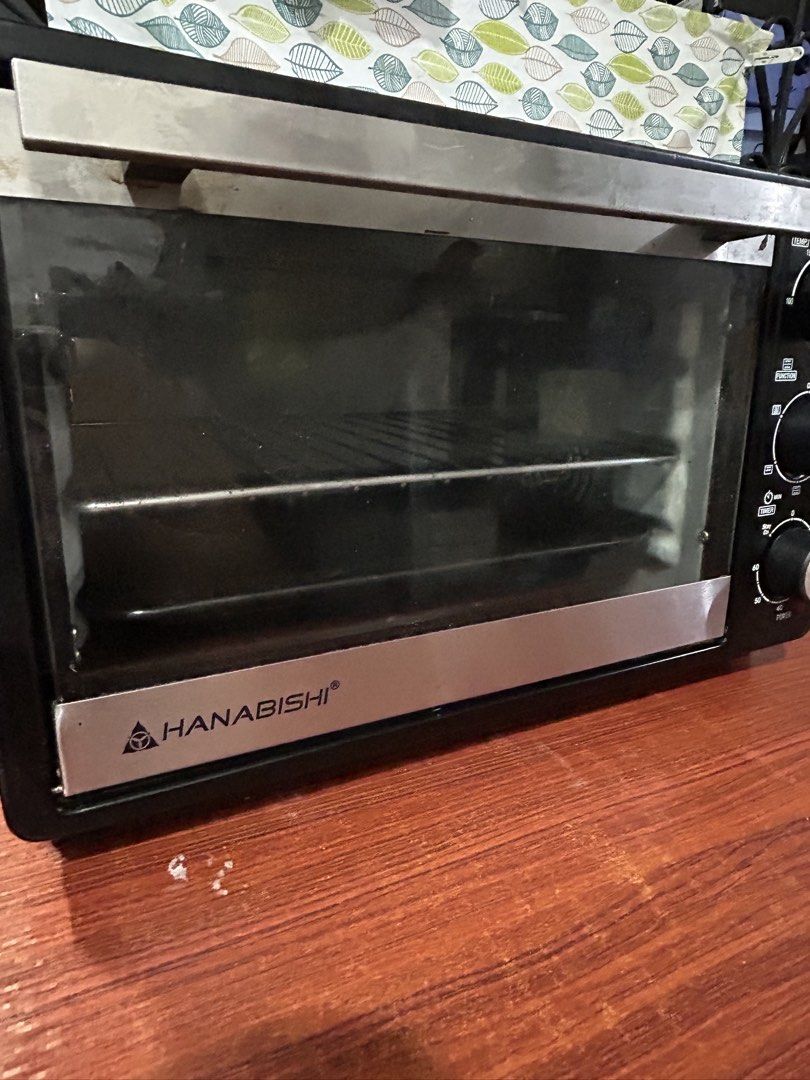 Hanabishi Electric Oven with Temperature and Timer Controls (Category: Ovens & Toasters) located in Taguig. Submitted by declutter_peach (Listing ID 1468929351, Image 2). Description: Selling my Hanabishi HEO-23R Electric Convection Oven! ✨ Details: * Brand: Hanabishi * Model: HEO-23R * Capacity: 23 liters * Power: 1,380 W * Temperature control: Up to 250°C * Convection fan * Includes wire rack and baking tray Condition: * Purchased around Januar