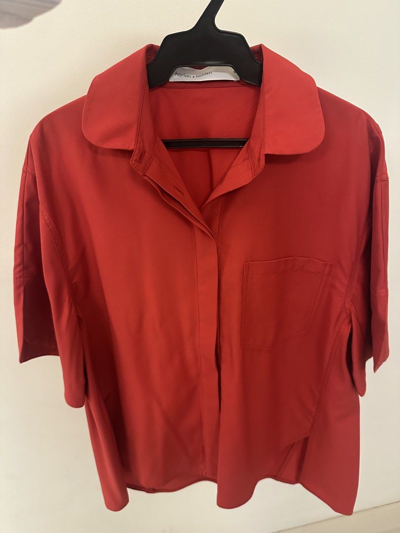 Harlan + Holden Red Button-Up Shirt (Category: Blouses) located in Makati City. Submitted by kaiout (Listing ID 1468817287, Image 1). Description: - Brand: Harlan + Holden - Color: Vibrant red (great pop of color) - Fit: Relaxed/loose fit with a slightly longer back hem. Can fit sizes M and L. - Details: Short sleeves, pointed collar, front chest pocket, hidden button placket, clean stitching - Material: Smooth, lightweight fabric - Versatility: 