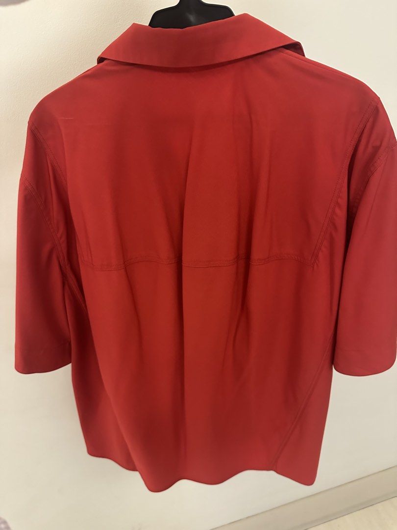 Harlan + Holden Red Button-Up Shirt (Category: Blouses) located in Makati City. Submitted by kaiout (Listing ID 1468817287, Image 2). Description: - Brand: Harlan + Holden - Color: Vibrant red (great pop of color) - Fit: Relaxed/loose fit with a slightly longer back hem. Can fit sizes M and L. - Details: Short sleeves, pointed collar, front chest pocket, hidden button placket, clean stitching - Material: Smooth, lightweight fabric - Versatility: 