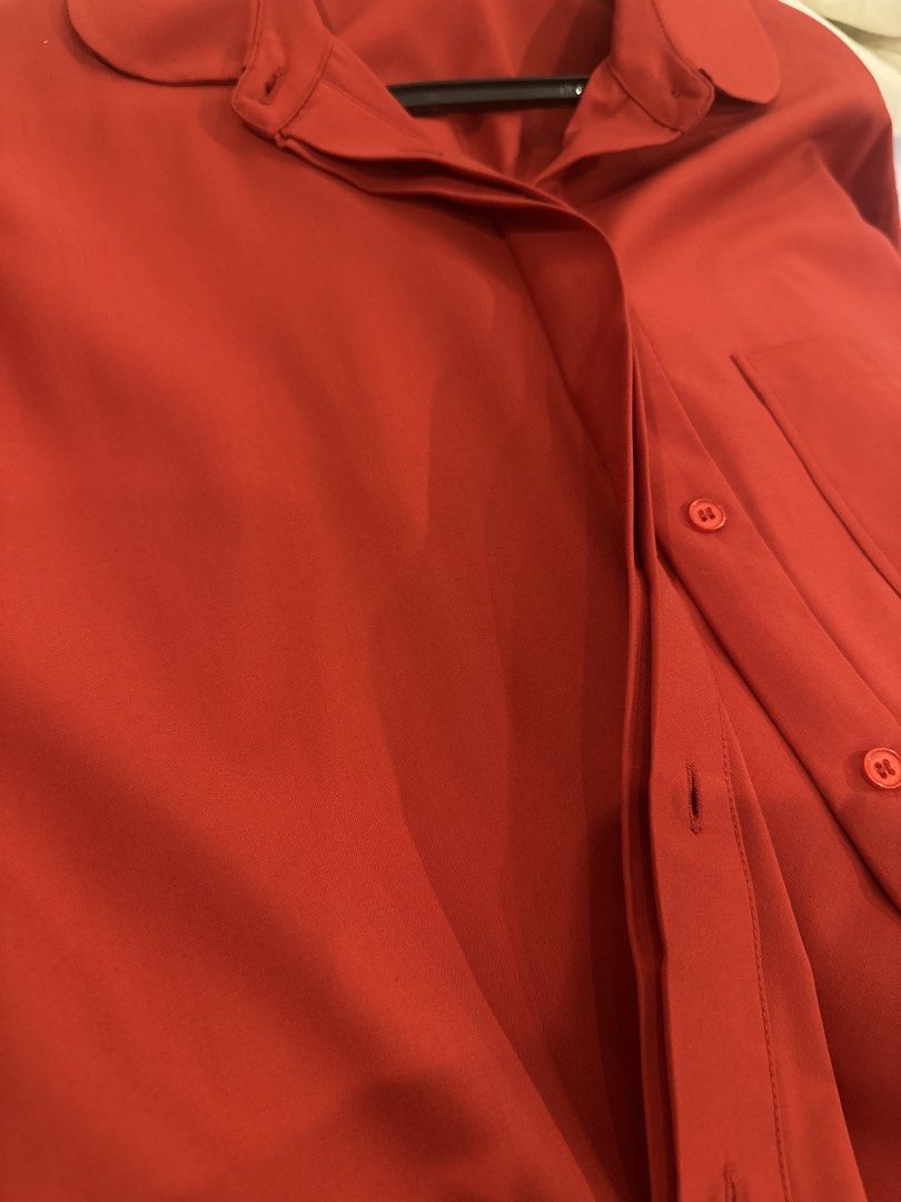 Harlan + Holden Red Button-Up Shirt (Category: Blouses) located in Makati City. Submitted by kaiout (Listing ID 1468817287, Image 3). Description: - Brand: Harlan + Holden - Color: Vibrant red (great pop of color) - Fit: Relaxed/loose fit with a slightly longer back hem. Can fit sizes M and L. - Details: Short sleeves, pointed collar, front chest pocket, hidden button placket, clean stitching - Material: Smooth, lightweight fabric - Versatility: 