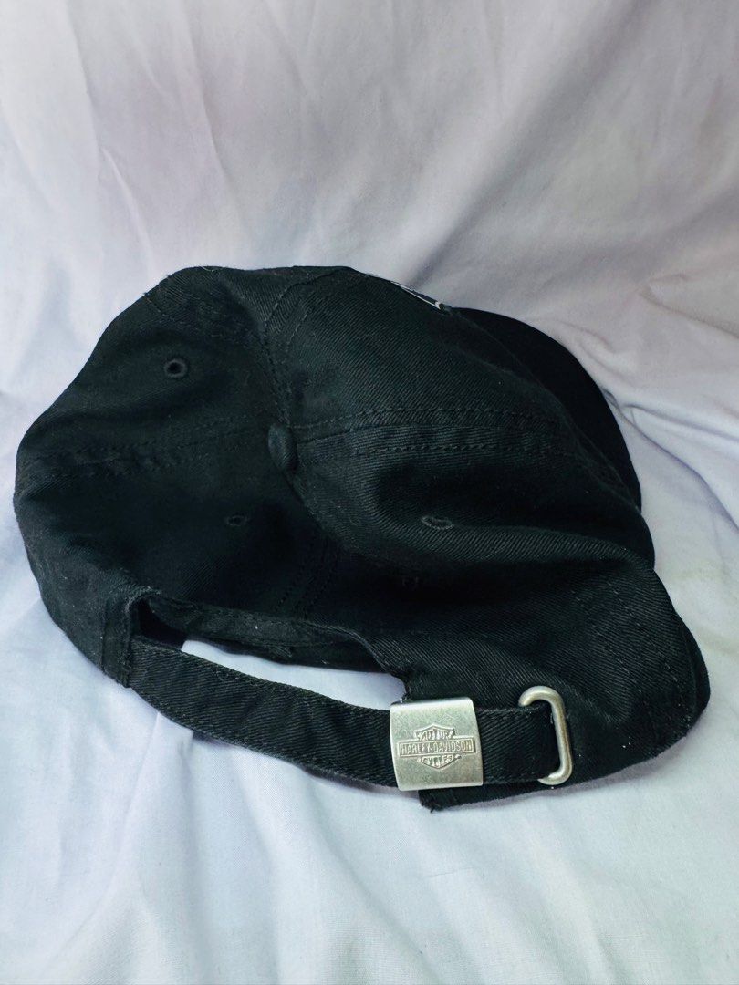 Harley Davidson 115 Years Black Baseball Cap (Category: Caps & Hats) located in Roxas City. Submitted by patsquarephantz (Listing ID 1468858039, Image 3). Description: - Official Harley-Davidson 115th Anniversary commemorative baseball cap - Classic black color with detailed embroidered front patch (115 Years & Since 1903) - Genuine Motor Clothes interior tag guaranteeing authenticity - Adjustable back strap with a durable metal clasp for a custo