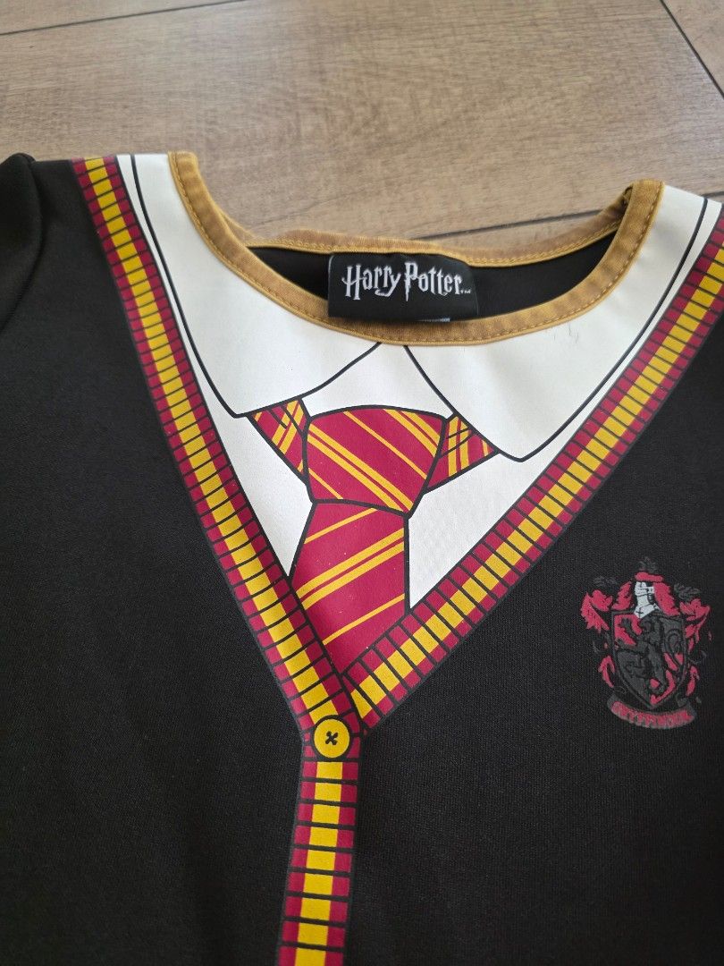 Harry Potter dress (Category: Babies & Kids Fashion) located in Quezon City. Submitted by preloved_by_mariekondo (Listing ID 1468930027, Image 2). Description: Harry Potter dress with black tulle skirt and glitter stars. Size 6-6x, fits 6yo Slight cracking on the rubber but still good, not so noticeable..
