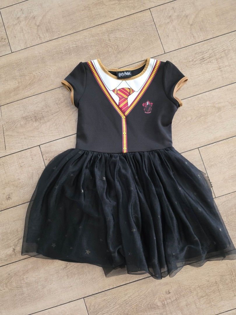 Harry Potter dress (Category: Babies & Kids Fashion) located in Quezon City. Submitted by preloved_by_mariekondo (Listing ID 1468930027, Image 1). Description: Harry Potter dress with black tulle skirt and glitter stars. Size 6-6x, fits 6yo Slight cracking on the rubber but still good, not so noticeable..