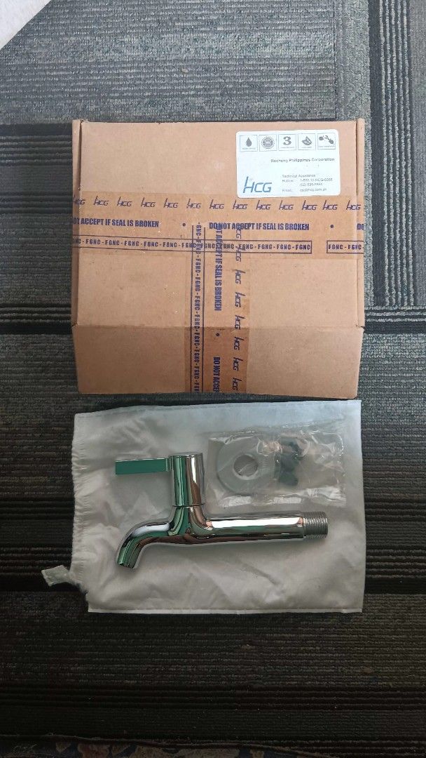 HCG chrome wall faucet with lever handle (Category: Bathroom & Kitchen Fixtures) located in Manila. Submitted by nicko1107 (Listing ID 1468778875, Image 1). Description: - Brand: HCG - Type: Chrome wall-mounted faucet with long spout and modern lever handle - Condition: Brand new, never installed (renovation leftover) - Inclusions: Original box, mounting ring, and hardware accessories in sealed plastic packaging - Finish: Shiny metallic chrome.