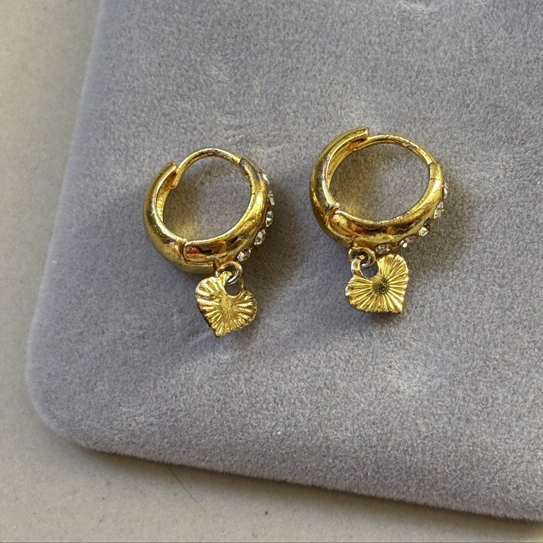 heart earrings (Category: Body Jewelry) located in Manila. Submitted by lavieelle (Listing ID 1468771003, Image 1). Description: - earrings on sale, branded & bought in italy - gold plated hoop earrings with embedded stones and a dangling heart charm - rfs: decluttering .