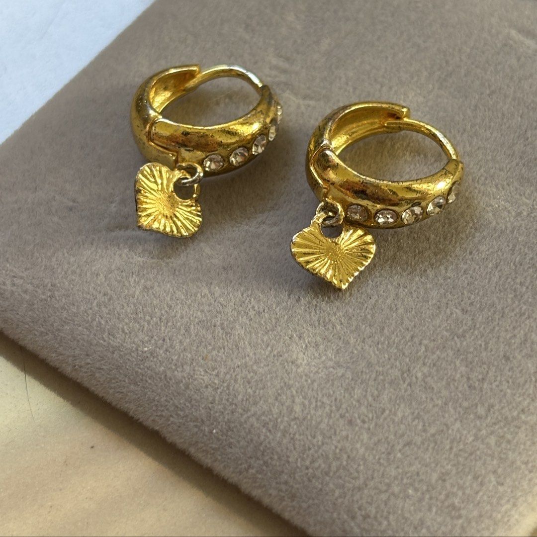 heart earrings (Category: Body Jewelry) located in Manila. Submitted by lavieelle (Listing ID 1468771003, Image 2). Description: - earrings on sale, branded & bought in italy - gold plated hoop earrings with embedded stones and a dangling heart charm - rfs: decluttering .