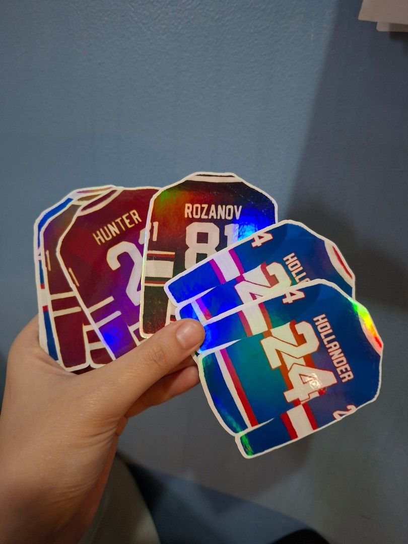 Heated Rivalry Holographic Stickers (Hollander, Rozanov, Hunter) (Category: Art & Prints) located in Pasay City. Submitted by Gloriem (Listing ID 1468777656, Image 3). Description: - Product: Holographic hockey jersey stickers (waterproof), 8 pieces - Players/Numbers: Hollander 24, Rozanov 81, and Hunter 21 - Finish: Shiny metallic, light-catching holographic effect - Colors: Blue, red, and black - Best for: Water bottles, laptops, and notebooks.