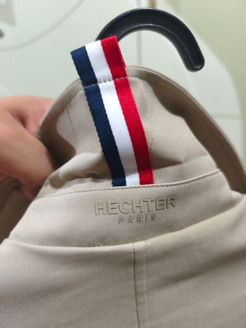 Hechter Paris Beige Jacket (Category: Coats, Jackets and Outerwear) located in Caloocan City. Submitted by johnangelod119-36458 (Listing ID 1468884616, Image 2). Description: - Brand: Hechter Paris - Color: Beige with navy lining - Measurements: 22 inches (width) x 30.5 inches (length) - Design details: Classic collar, front flap pockets, button cuffs, and tricolor ribbon loop at the back collar - Style: Clean look, perfect for casual or smart ou