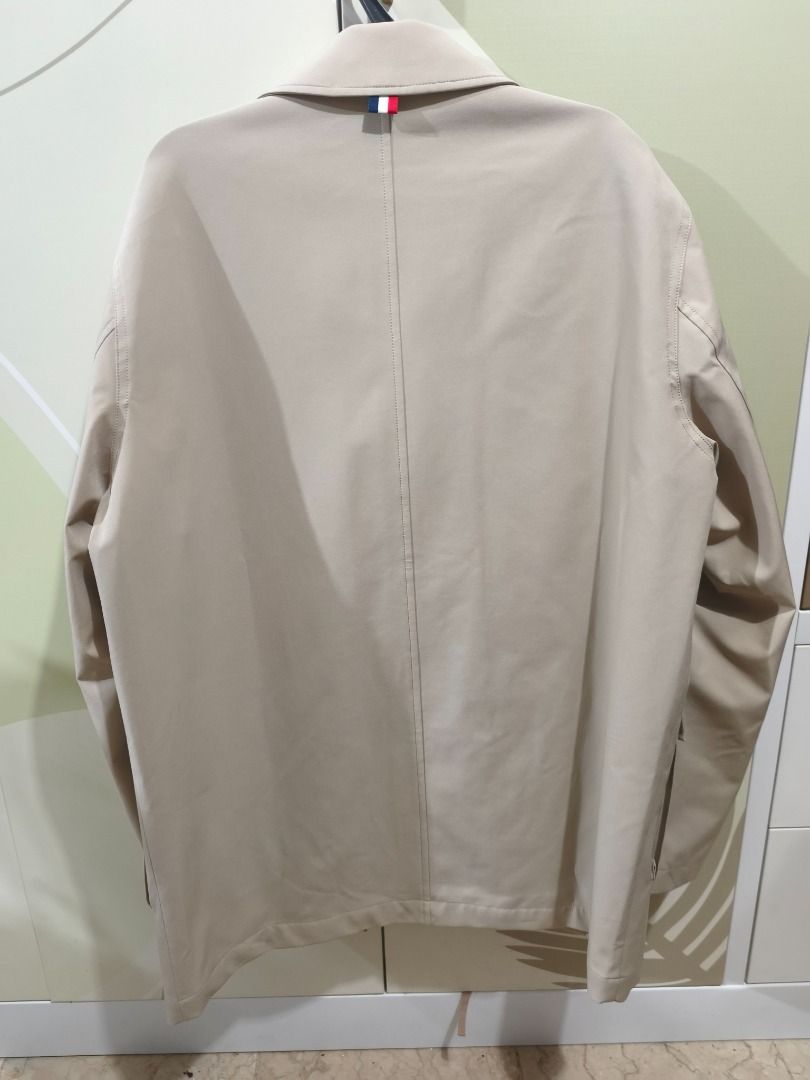 Hechter Paris Beige Jacket (Category: Coats, Jackets and Outerwear) located in Caloocan City. Submitted by johnangelod119-36458 (Listing ID 1468884616, Image 3). Description: - Brand: Hechter Paris - Color: Beige with navy lining - Measurements: 22 inches (width) x 30.5 inches (length) - Design details: Classic collar, front flap pockets, button cuffs, and tricolor ribbon loop at the back collar - Style: Clean look, perfect for casual or smart ou