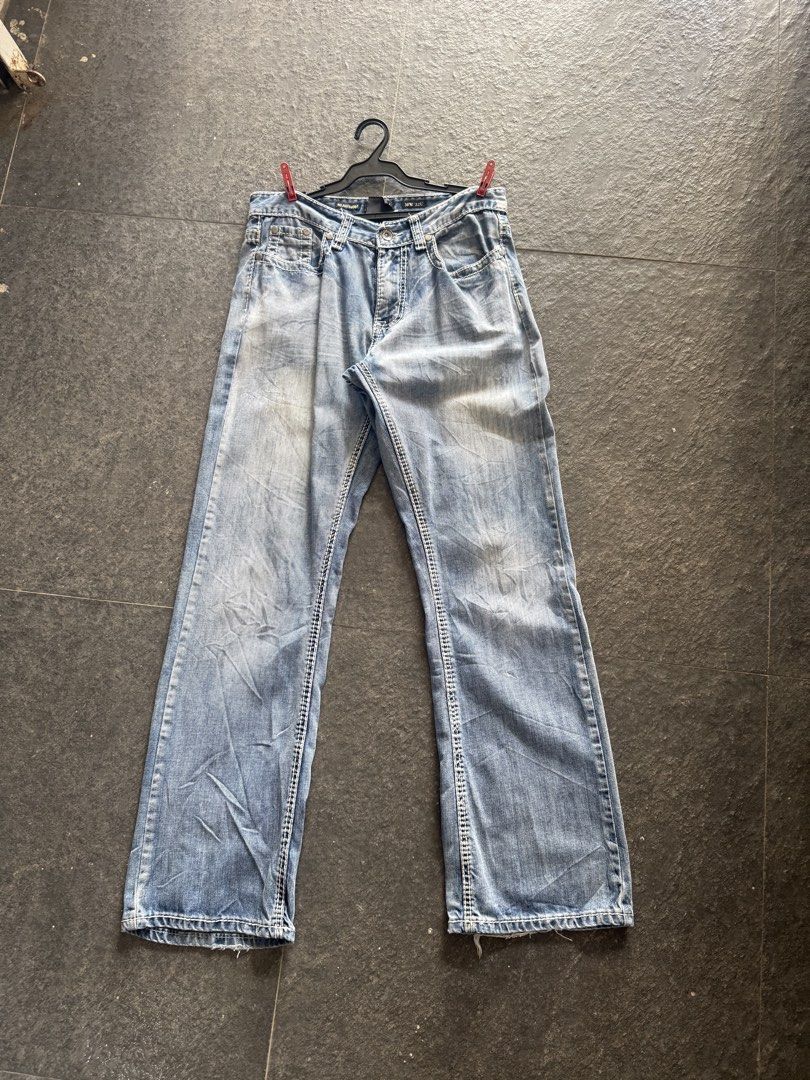 Helix Relaxed Bootcut Jeans 30W 32L (Category: Jeans) located in Burgos, Ilocos Norte. Submitted by copthrift (Listing ID 1468721940, Image 1). Description: Helix relaxed bootcut jeans in a light blue wash. Size 30 waist, 32 length. 100% cotton material. Unique cross design embroidered on both back pockets with distressing details. Made in China. Great Y2K style denim with contrast stitching throughout. Regular button and zip fly closure..