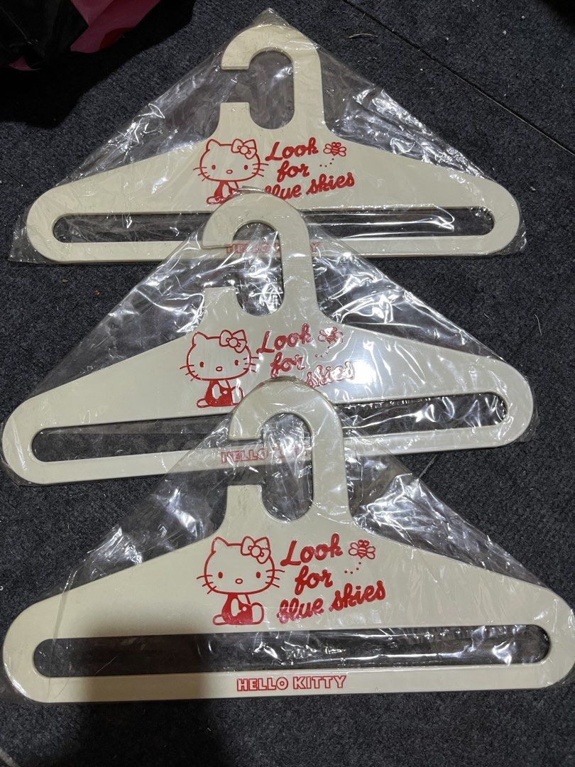 Hello Kitty Look For Blue Skies Plastic Hangers Set (Category: Hooks & Hangers) located in Manila. Submitted by janetecson05 (Listing ID 1468929364, Image 1). Description: - Set of 3 cream-coloured plastic clothes hangers - Features cute Kitty graphics and red 'Look for blue skies' text - Kitty branding on the bottom bar - Brand new and individually sealed in original plastic packaging - Perfect for Sanrio fans and wardrobe organization - Meetup 