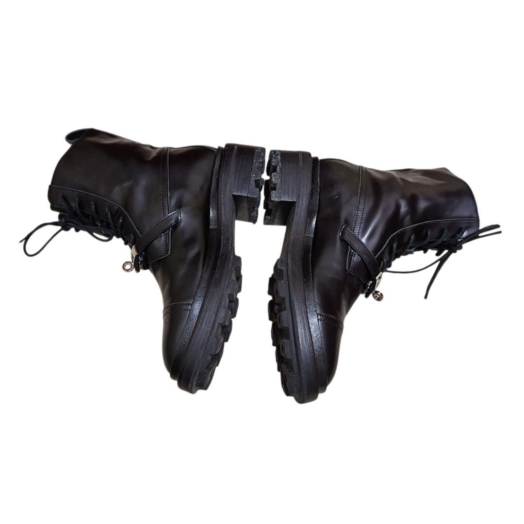 Hermes Black Leather Combat Boots Size 38 (Category: Boots) located in Nasugbu. Submitted by staffpicks1515 (Listing ID 1468787202, Image 3). Description: - Brand: Hermes - Style: Combat boots - Size: EU 38 - Color: Black - Material: Premium leather - Details: Lace-up front, signature silver-tone hardware buckle strap, rounded cap toe, lug soles, and back pull tab - Origin: Made in Italy - Condition: Excellent / Well-maintained.