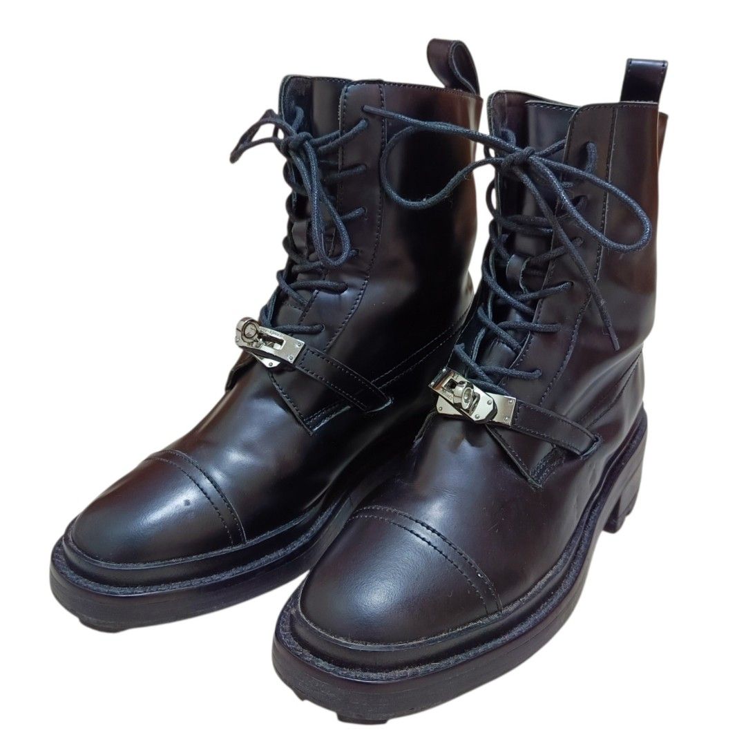 Hermes Black Leather Combat Boots Size 38 (Category: Boots) located in Nasugbu. Submitted by staffpicks1515 (Listing ID 1468787202, Image 2). Description: - Brand: Hermes - Style: Combat boots - Size: EU 38 - Color: Black - Material: Premium leather - Details: Lace-up front, signature silver-tone hardware buckle strap, rounded cap toe, lug soles, and back pull tab - Origin: Made in Italy - Condition: Excellent / Well-maintained.