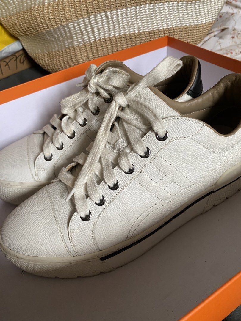 Hermes Voltage White Leather Sneakers (Category: Sneakers) located in Pasay City. Submitted by chesco. (Listing ID 1468745637, Image 1). Description: - Authentic Hermes white leather sneakers - Chic black heel tabs and trendy chunky soles - Features debossed Hermes branding at the back and subtle H motif on the side - Condition: Light signs of wear on midsoles - Inclusions: Original orange box and three dust bags with drawstring closures - Guaran