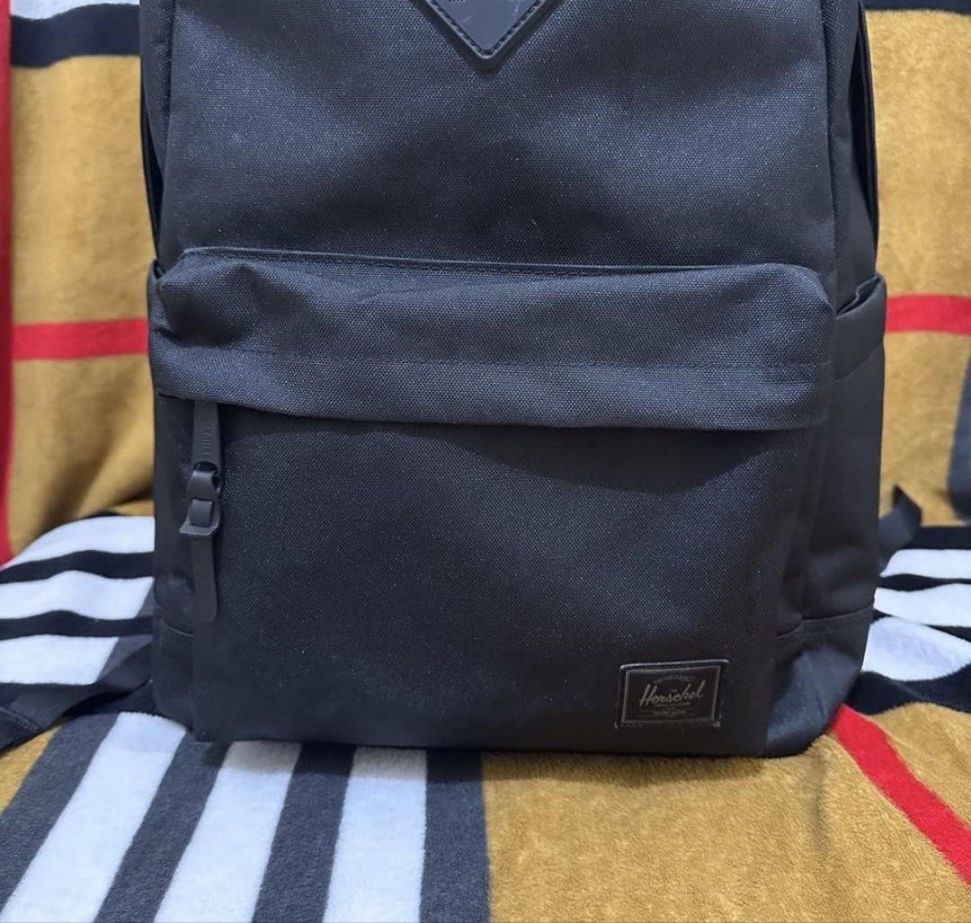 Herschel Heritage 24L Black Tonal (Category: Backpacks) located in Dasmarinas. Submitted by jco.ollirum (Listing ID 1468725512, Image 2). Description: Herschel Heritage 24L Black Tonal - Signature diamond detail padded floating sleeve fits a 15in/16in laptop - 18" (H) x 12.2" (W) x 6.5" (D) - Almost New/Like New/ Used 4-5 Times - Customized with inner zipper pocket (see pictures/detachable) - Comes with tags - Bought for: SRP 5,790 - Selling for: