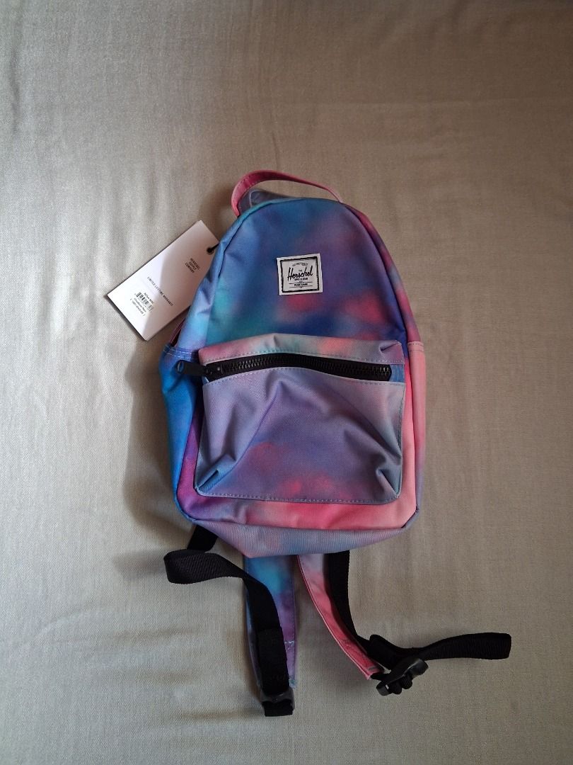 Herschel Nova mini backpack (Category: Backpacks) located in Quezon City. Submitted by threeleggeddog (Listing ID 1468826559, Image 1). Description: brand new cloudburst neon color.