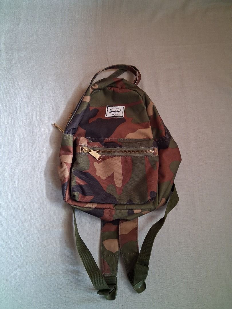 Herschel Nova mini backpack (Category: Backpacks) located in Quezon City. Submitted by threeleggeddog (Listing ID 1468829254, Image 1). Description: pre-loved 9/10 condition camo color.
