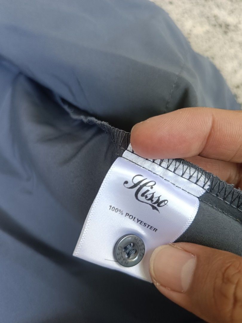HISSO Grey Button-Up Shirt (Category: Tshirts & Polo Shirts ) located in Urdaneta. Submitted by tetsudoubletaps (Listing ID 1468736522, Image 3). Description: + SF 23 x 25 - 26 (Boxy) Ganda nito, makapal. Issue: Missing button pero may extra kayo nalang magtahi - Brand: HISSO - Size: S - Color: Grey - Material: 100% polyester (lightweight and breathable) - Features: Classic collar, front button closure, and left chest pocket - Condition: Great fo