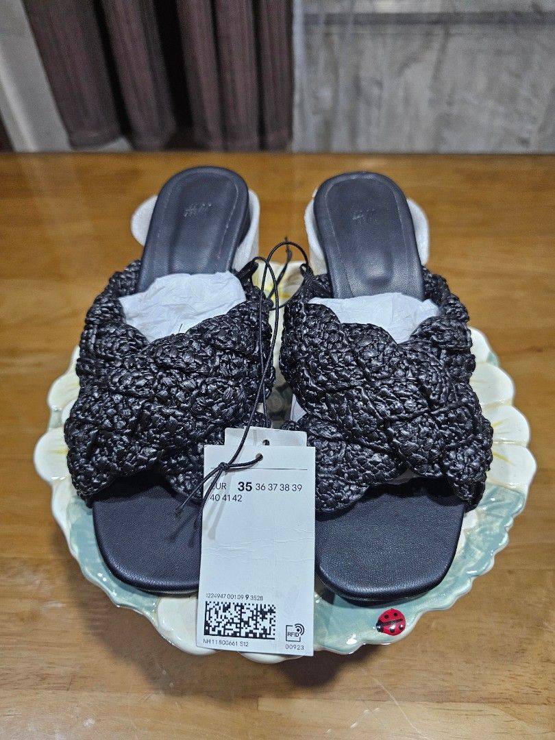 H&M Black Slip On Heeled Sandals (Category: Flats & Sandals) located in Bulacan. Submitted by jibbersd (Listing ID 1468749064, Image 1). Description: - Brand: H&M - Item: Black slide sandals with textured braided strap - Condition: Brand new with tags (BNWT), packing paper still inside to maintain shape - Size: EU 35 - Style: Flat sole, slip-on design - Perfect for casual, effortless everyday outfits Note: Payment first through Gcash before dispa