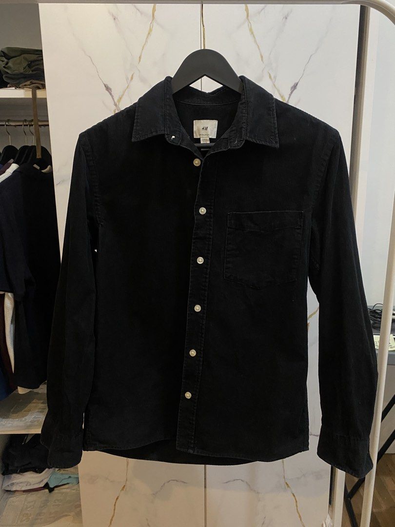 H&M CORDUROY SHIRT (Category: Tshirts & Polo Shirts ) located in Manila. Submitted by declutterlord (Listing ID 1468914084, Image 1). Description: Brand: H&M - Color: Black - Size: XS (Regular Fit) - Dimensions: 19.5in x 27in Notes: - ZERO bleach stains - ZERO puncture holes - ZERO loose buttons - CONSISTENT corduroy line pattern with no breaks or tears - NEGLIGIBLE fading (9.8/10) along the inner collar that is hardly noticeable when worn. - NEV