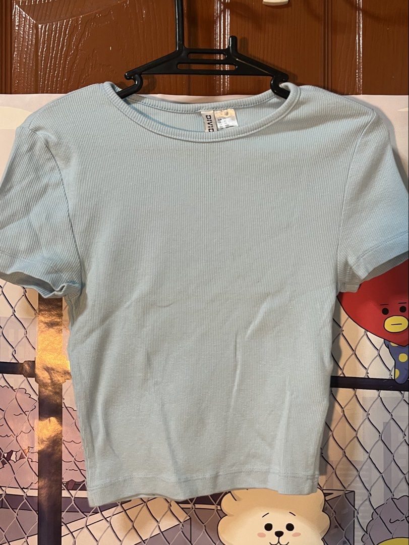 H&M Divided Light Blue Ribbed Crop Top XS (Category: Shirts) located in Marikina City. Submitted by yssacee (Listing ID 1468908227, Image 2). Description: - Brand: H&M Divided - Size: XS (true to size) - Color: Light blue - Material: Stretchy, comfortable ribbed knit - Style: Short sleeves, crew neck, crop top - Condition: Excellent, no stains or tears - Perfect for pairing with high-waisted jeans or shorts - rfs: does not fit me anymore - shippi