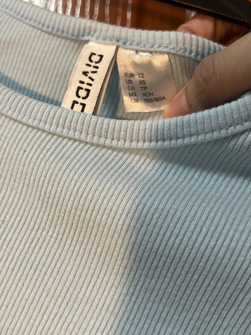 H&M Divided Light Blue Ribbed Crop Top XS (Category: Shirts) located in Marikina City. Submitted by yssacee (Listing ID 1468908227, Image 1). Description: - Brand: H&M Divided - Size: XS (true to size) - Color: Light blue - Material: Stretchy, comfortable ribbed knit - Style: Short sleeves, crew neck, crop top - Condition: Excellent, no stains or tears - Perfect for pairing with high-waisted jeans or shorts - rfs: does not fit me anymore - shippi