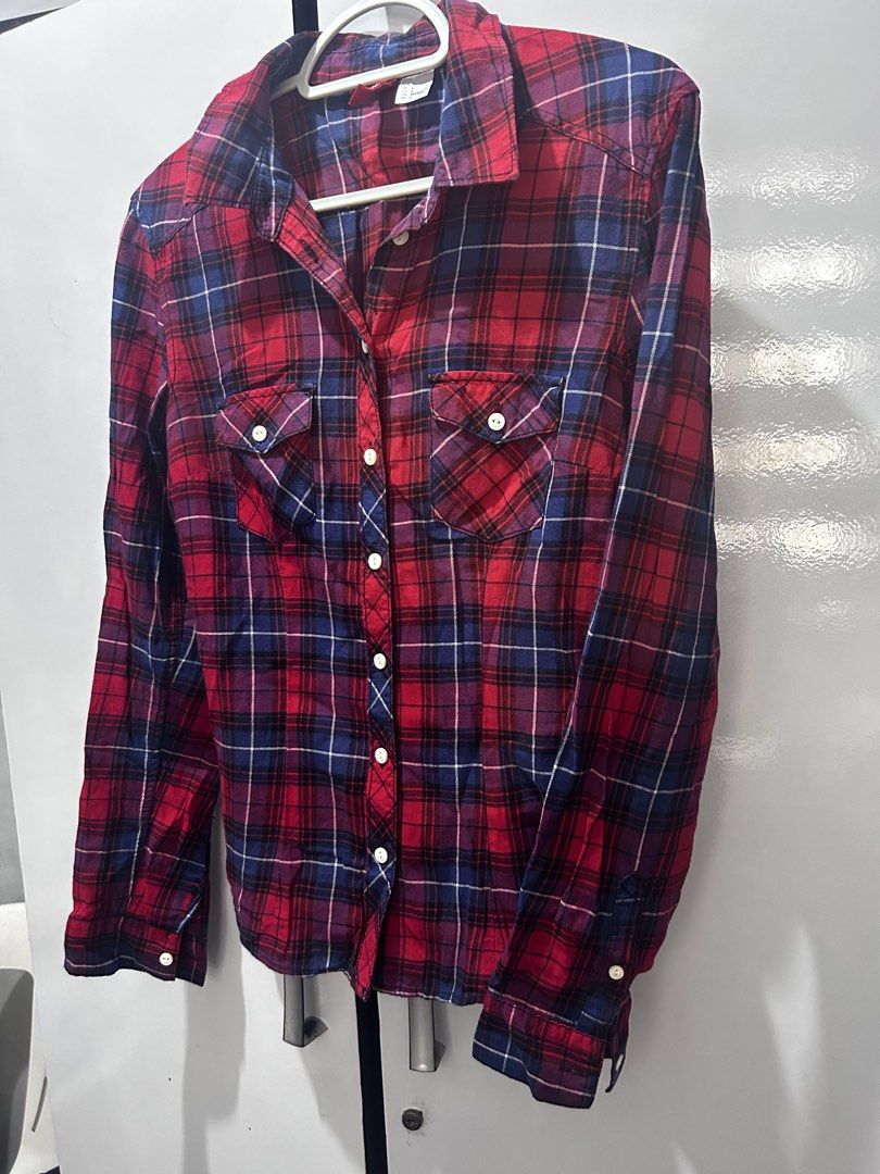 H&M Divided Red & Navy Button-Down Shirt (Category: Longsleeves) located in Pasig City. Submitted by ladyleslieisletavelarde4902 (Listing ID 1468761125, Image 2). Description: A classic grunge-chic plaid button-down woven in vibrant red and navy tones—the ultimate layering piece for effortless, casual cool. Brand: H&M Size: Tag EUR 34 / US 4 (Fits XS–S) Style: Long-Sleeve Button-Down Flannel Shirt with Chest Pockets Purchase direct from store Shi