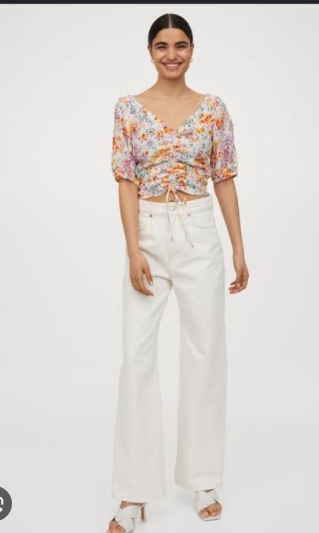 H&M Draped Floral Crop Top (Category: Blouses) located in Cebu City. Submitted by cebuanamomshies (Listing ID 1468712985, Image 2). Description: M-L cream background with a multicolor floral print, a deep V-neck, a front drawstring cinch, and short puff sleeves. viscous crepe weave. wide smock at the back.