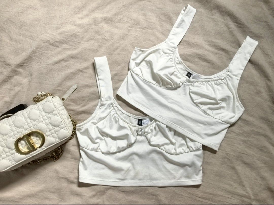 H&M White Ruched Crop Top Bundle (Category: Sleeveless) located in Tacloban City. Submitted by thead.declutters (Listing ID 1468808748, Image 1). Description: - Brand: H&M DIVIDED - Quantity: Set of 2 - Details: Square neckline, ruched bust, cute center bow, thick shoulder straps - Material: Super stretchy and comfortable fabric - Styling: Perfect to pair with high-waisted denim or skirts - Condition: Great wardrobe basics.