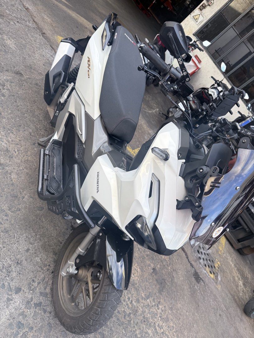 Honda ADV160 Scooter White (Category: Motorbikes for Sale) located in Paranaque City. Submitted by purepenguin_3c3b2f (Listing ID 1468773360, Image 2). Description: FOR SALE ADV160 2024 ACCESSORIES PPF worth 20k Crash Guard MD Senlo m5+ 100w Dual Horn (piaa & stock) RC Brake Lever w/ parking brake Motowolf holder Motowolf riser Motowolf bottle holder wind shield riser Smoke Windshield TRC Side mirror TRC Radiator Semi flat seat compartment cover 