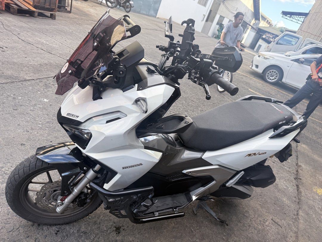 Honda ADV160 Scooter White (Category: Motorbikes for Sale) located in Paranaque City. Submitted by purepenguin_3c3b2f (Listing ID 1468773360, Image 1). Description: FOR SALE ADV160 2024 ACCESSORIES PPF worth 20k Crash Guard MD Senlo m5+ 100w Dual Horn (piaa & stock) RC Brake Lever w/ parking brake Motowolf holder Motowolf riser Motowolf bottle holder wind shield riser Smoke Windshield TRC Side mirror TRC Radiator Semi flat seat compartment cover 