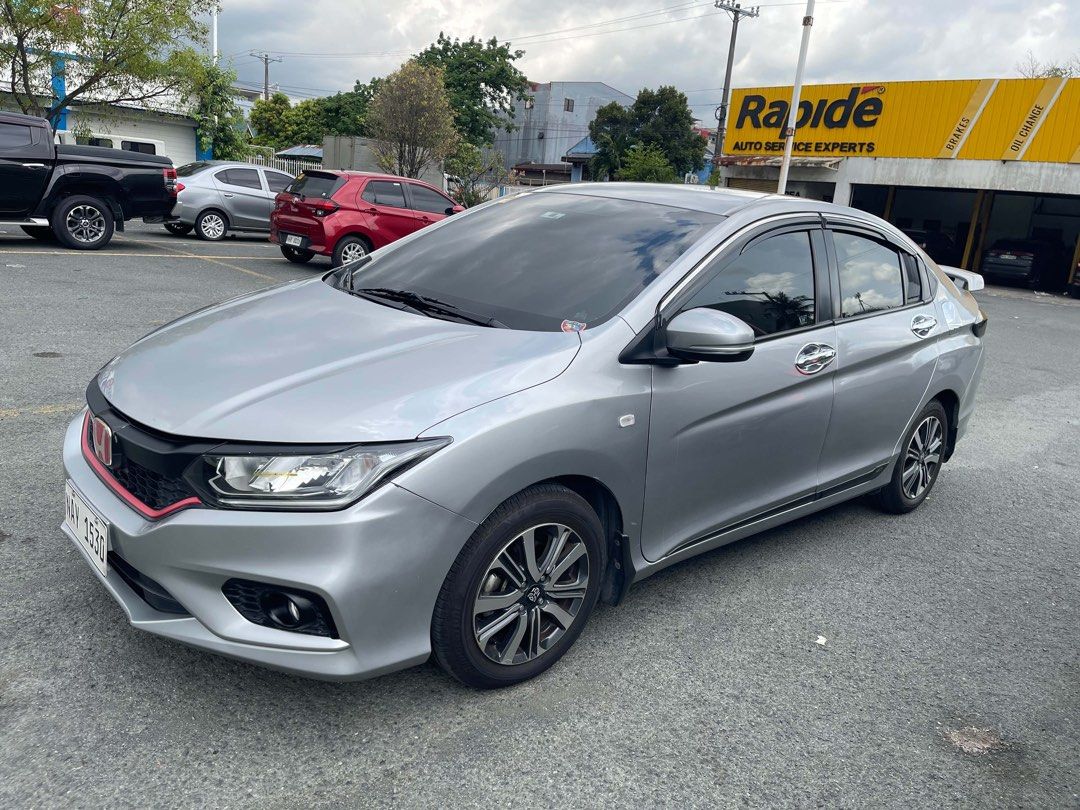 Honda City 1.5 Basic V Sedan i-VTEC (A) (Category: Used Cars) located in Cainta. Submitted by annestore23 (Listing ID 1468753822, Image 3). Description: • RUSH SALE: HONDA CITY 2019 AT 1.5 E CVT *Selling Price: P450,000.00 Features and inclusions: * 4 brand-new tires * New trunk board * With trunk tray * Newly registered with LTO for 2026-2027 * with DashCam *Upgraded Tail Light *with rain guard *new wiper *with back sensor *with matting -Locatio