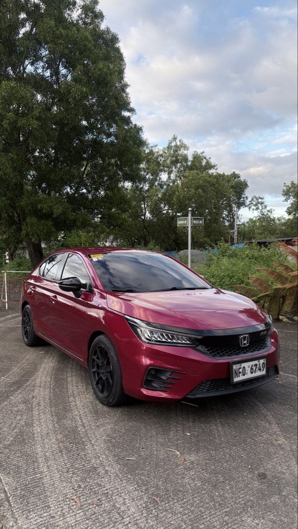 Honda City 1.5 Basic V Sedan i-VTEC (A) (Category: Used Cars) located in Caloocan City. Submitted by keenphoenix.122251 (Listing ID 1468744174, Image 3). Description: 🚗 FOR SALE! FOR SALE! FOR SALE! 2022 Honda City 1.5 RS Sedan A/T ⛽ Gasoline | Automatic Transmission 💰 PRICE: ₱750,000 ONLY! TOP-OF-THE-LINE RS VARIANT! ✅ Ignite red Metallic ✅ 43,769 KM Mileage (Original) ✅ Ending Plate Number: 9 ✅ Paddle Shifters ✅ Push-Button Engine Start ✅ Lea