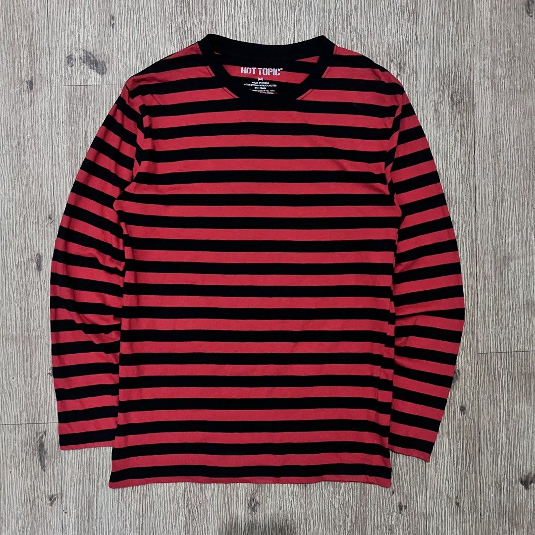 HOT TOPIC Red & Black Striped Long Sleeve (Category: Coats, Jackets and Outerwear) located in San Fernando. Submitted by curatedbyji_404 (Listing ID 1468722899, Image 2). Description: HOT TOPIC Red & Black Striped Long Sleeve Classic alt / emo / grunge staple piece. Maganda ang striped pattern at madaling iterno sa layered streetwear outfits. Brand: Hot Topic Color: Red / Black (Striped) Style: Long Sleeve Striped Shirt Size on Tag: Medium Fit: M