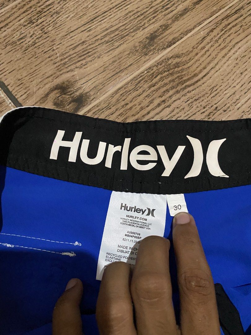 Hurley Phantom Boardshorts Blue White Size 30 (Category: Swim Trunks & Board Shorts) located in Binalbagan. Submitted by southsidethrift22 (Listing ID 1468837521, Image 3). Description: - Brand: Hurley Phantom - Size: Waist 30 - Color: Blue and White - Design: Striped pattern on left leg, Hurley logo patch on right - Features: Secure back pocket with flap, adjustable drawstring waistband - Material: Super lightweight, ideal for surfing and swimmi