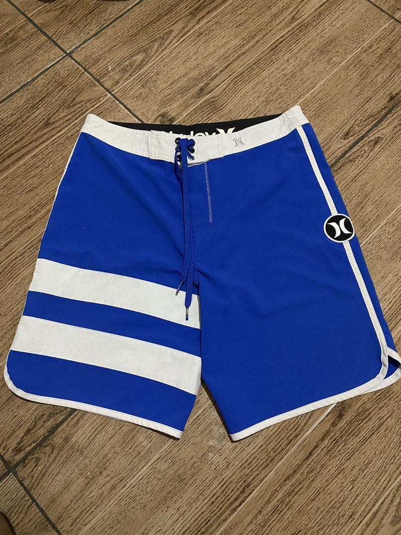 Hurley Phantom Boardshorts Blue White Size 30 (Category: Swim Trunks & Board Shorts) located in Binalbagan. Submitted by southsidethrift22 (Listing ID 1468837521, Image 1). Description: - Brand: Hurley Phantom - Size: Waist 30 - Color: Blue and White - Design: Striped pattern on left leg, Hurley logo patch on right - Features: Secure back pocket with flap, adjustable drawstring waistband - Material: Super lightweight, ideal for surfing and swimmi