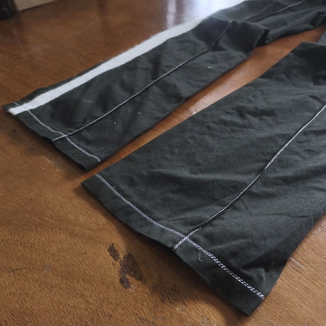 IHNN Japan track pants (Category: Luxury Apparel) located in Tayabas. Submitted by cat.b0i (Listing ID 1468822150, Image 3). Description: Size: 26-30 ‎rise: 10.5 ( mid Waisted) ‎hips: 37 ‎thighs: 11.5 ‎length: inseam: 29 ‎outseam : 40 ‎Hem: 9 ‎ ‎color: Army green with white ‎material: 100% cotton properties: Fraying on every hem because of extra fabric after stitching hardware: ‎issue: none, fraying is a natural effect ‎condition: excellent.