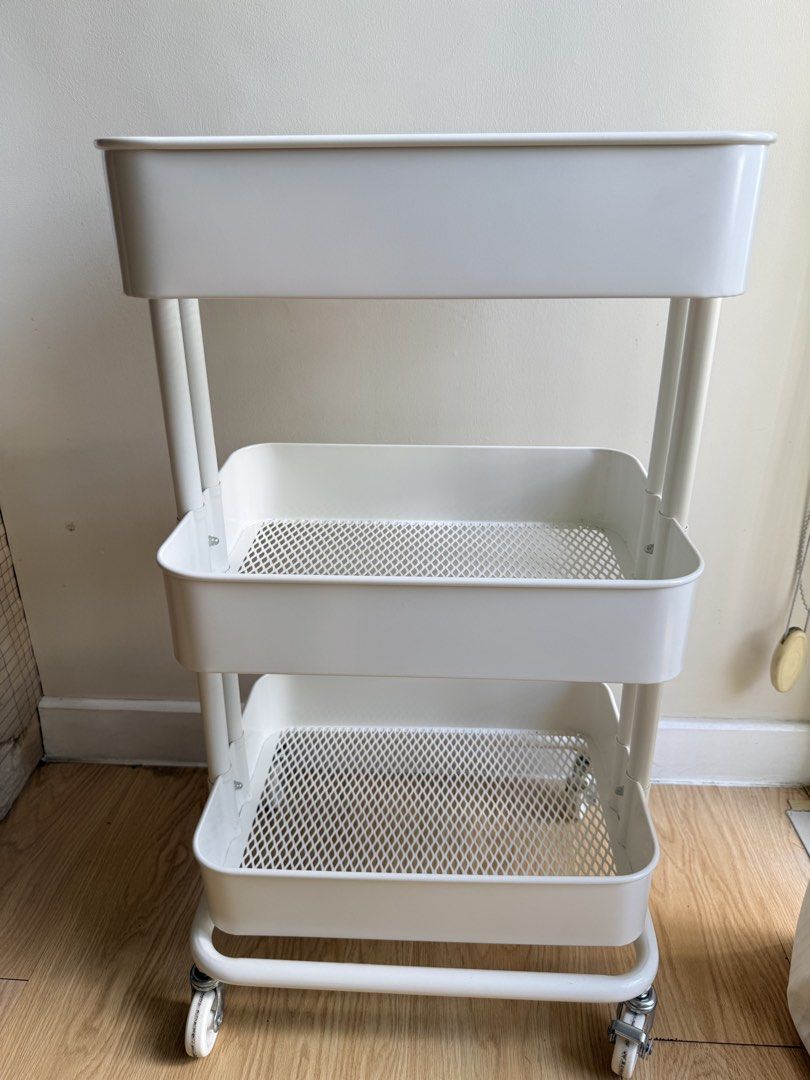 IKEA 3-Tier Rolling Utility Cart (Category: Shelves, Cabinets & Racks) located in Pasig City. Submitted by vdejesus (Listing ID 1468715215, Image 2). Description: 🛒 IKEA 3-Tier Rolling Utility Cart 📦 Product Details & Features: Design: 3-tier deep basket shelves with ventilated mesh bottoms Color: Clean Matte White Material: Durable Powder-Coated Steel / Metal Mobility: 4 Heavy-duty 360-degree swivel wheels (2 lockable wheels for stability) ✨ C