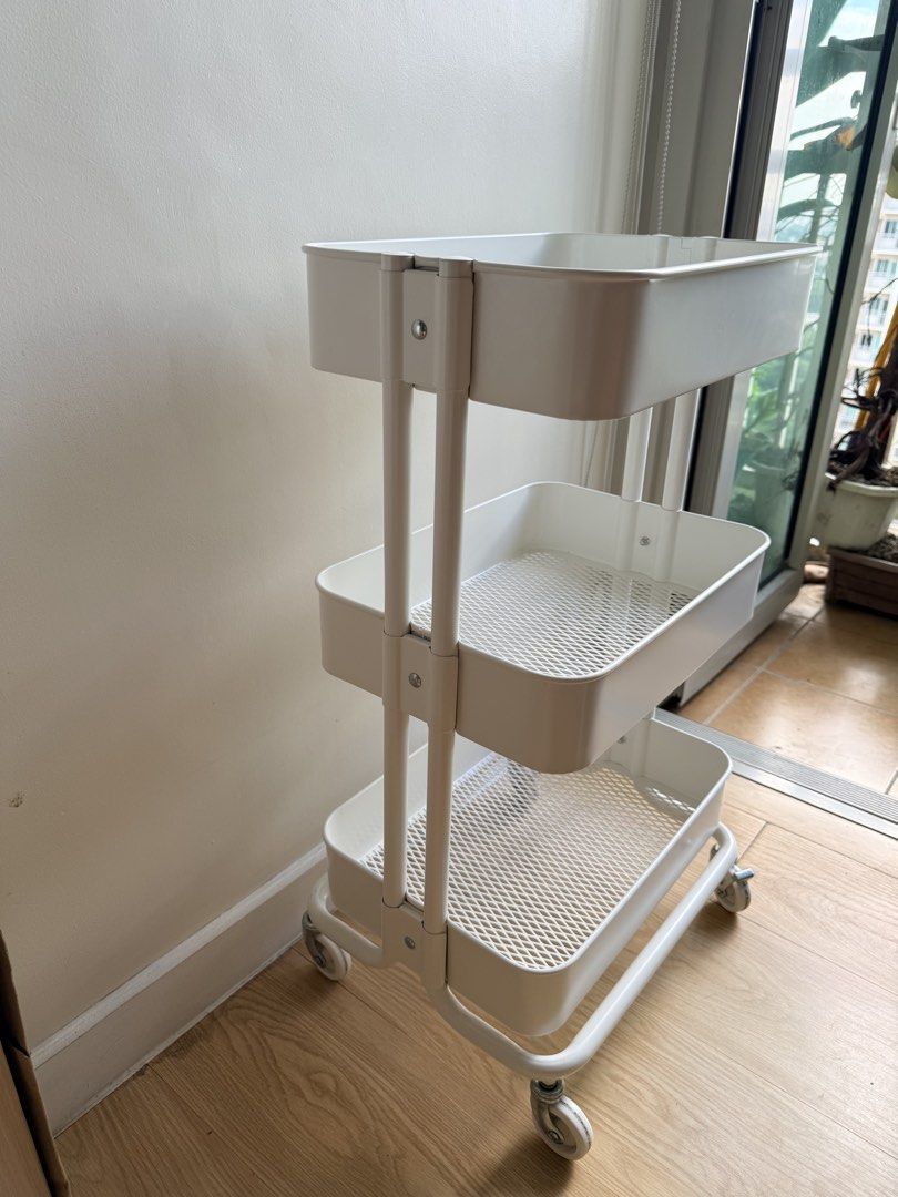 IKEA 3-Tier Rolling Utility Cart (Category: Shelves, Cabinets & Racks) located in Pasig City. Submitted by vdejesus (Listing ID 1468715215, Image 1). Description: 🛒 IKEA 3-Tier Rolling Utility Cart 📦 Product Details & Features: Design: 3-tier deep basket shelves with ventilated mesh bottoms Color: Clean Matte White Material: Durable Powder-Coated Steel / Metal Mobility: 4 Heavy-duty 360-degree swivel wheels (2 lockable wheels for stability) ✨ C