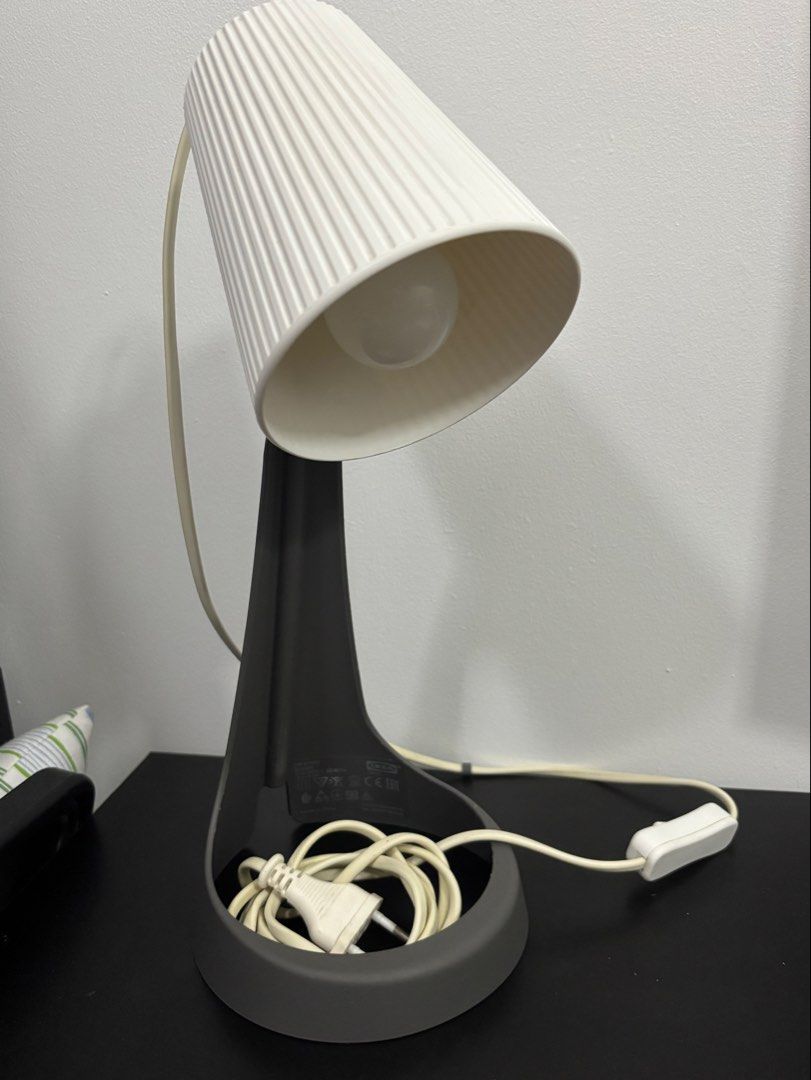 IKEA Svallet Desk Lamp Grey White (Category: Lighting) located in Makati City. Submitted by angelliepurrrr (Listing ID 1468768973, Image 1). Description: - Item: IKEA Svallet Work Lamp - Color: Grey and white with textured shade - Condition: Clean and 100% working - Features: Includes power cord with inline switch and bulb - Perfect for: Desks or bedside *Bulb included. .
