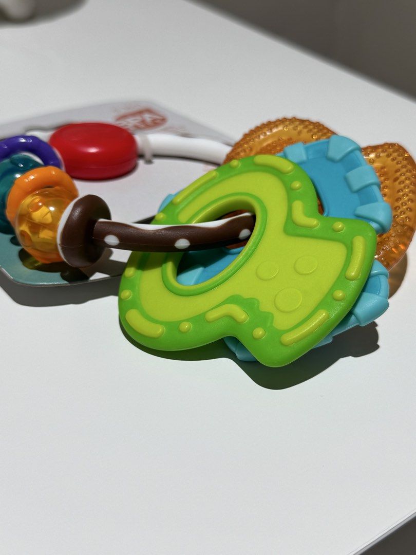 Infantino Cool & Chew Teether Keys (Category: Soothers & Pacifiers) located in Quezon City. Submitted by joyeusefille (Listing ID 1468872892, Image 3). Description: Infantino Cool & Chew Teether Keys for babies 0-36 months. BPA-free, multi-textured keys soothe sore gums and are easy for little hands to hold. Brand new in original packaging!.